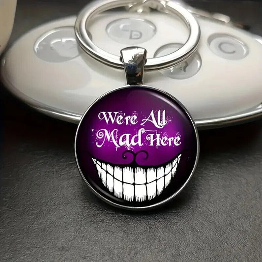 ALICE Grinning Cheshire Cat Keychain Gift We're All MAD Here Purple